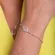 Pulseira Corrente Bolinha e Pingente Mão de Fátima Cravejado com Zircônias