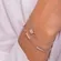 Pulseira Duas Correntes Pingente Florzinha Cravejado com Zircônias