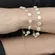 Pulseira de Pérola Barroca com Detalhe Redonda Achatada