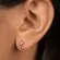 Brinco Pequeno Meia Lua Cravejado com Três Zircônias Banhado a Ouro 18 k