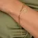 Pulseira Corrente Cartier com Pingente Circular Vazado e Árvore da Vida Cravejada com Zircônias Banh