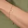 Pulseira de Bolinhas com Pingente Divino Cravejado Banhada a Ouro 18k