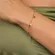 Pulseira com Pingentes de Cristais e Estrelas Banhada a Ouro 18K