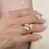 Anel Regulável Dois Aros com  Borboletas e Zircônias Banhado a Ouro 18k