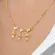 Colar Coração com Três Filhos Cravejado com Zircônias Banhado a Ouro 18 k