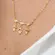 Colar Coração com Três Filhos Cravejado com Zircônias Banhado a Ouro 18 k