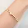 Pulseira Bracelete Nó Cravejado Banhada a Ouro 18K