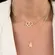 Colar Choker Coração Cravejado com Zircônias com Patinha Lisa no Centro Banhado a Ouro 18K