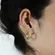 Brinco Earcuff  Pena Cravejado com Zircônias
