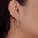 Brinco Dois Aros Entrelaçados